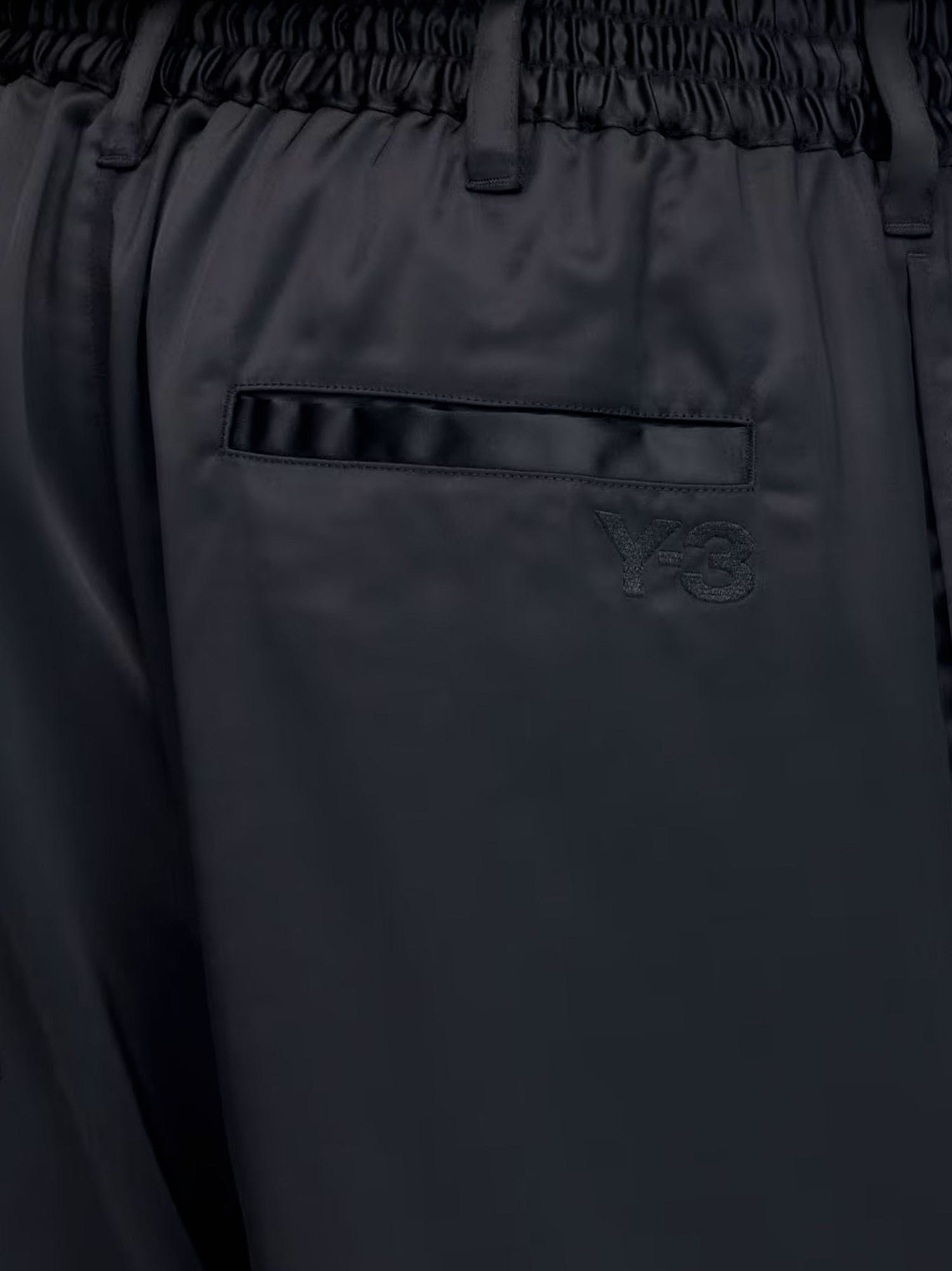 adidas Technical fabric trousers with iconic side stripes