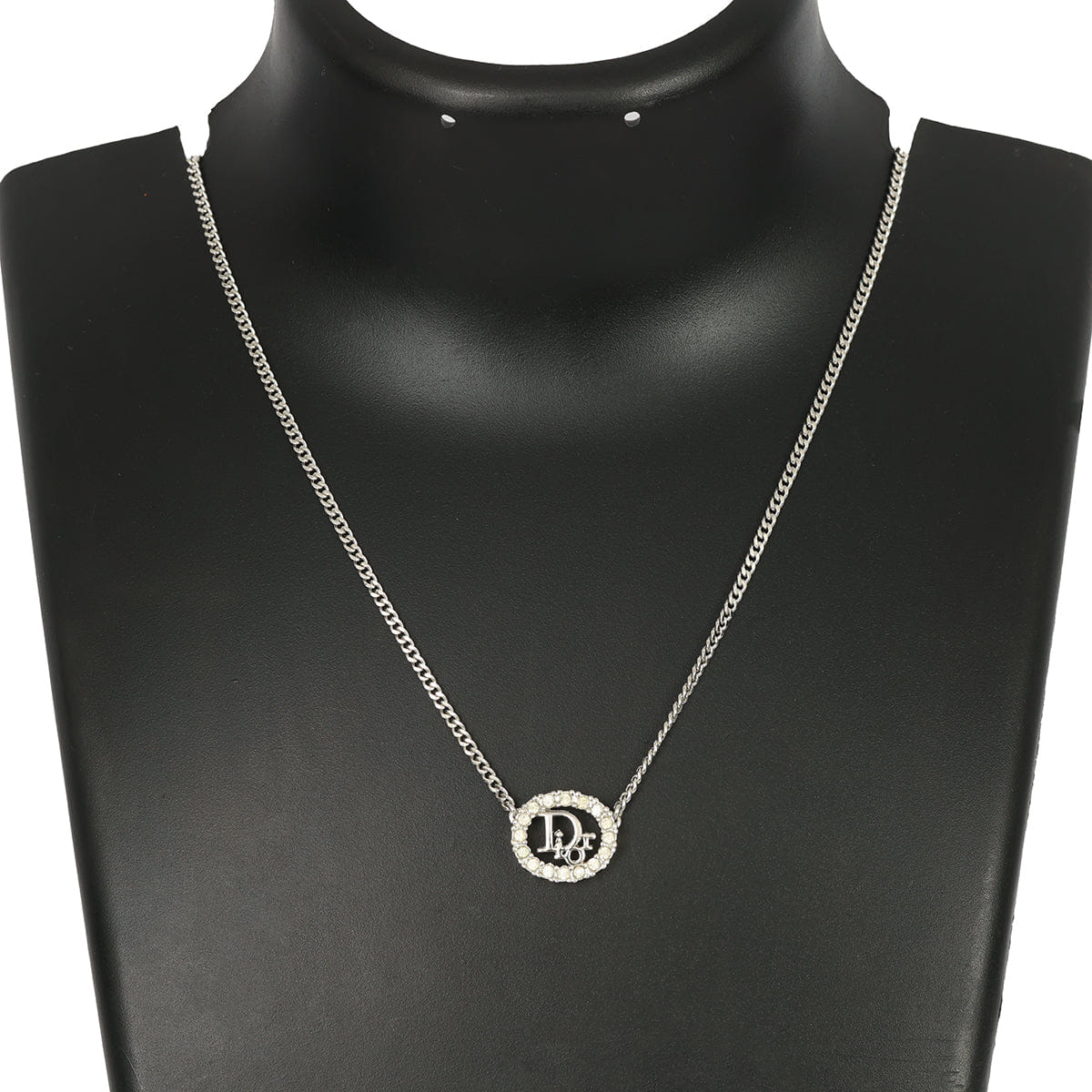 CHRISTIAN DIOR SILVER - TONE OVAL PENDANT WITH CRYSTAL DIOR LOGO