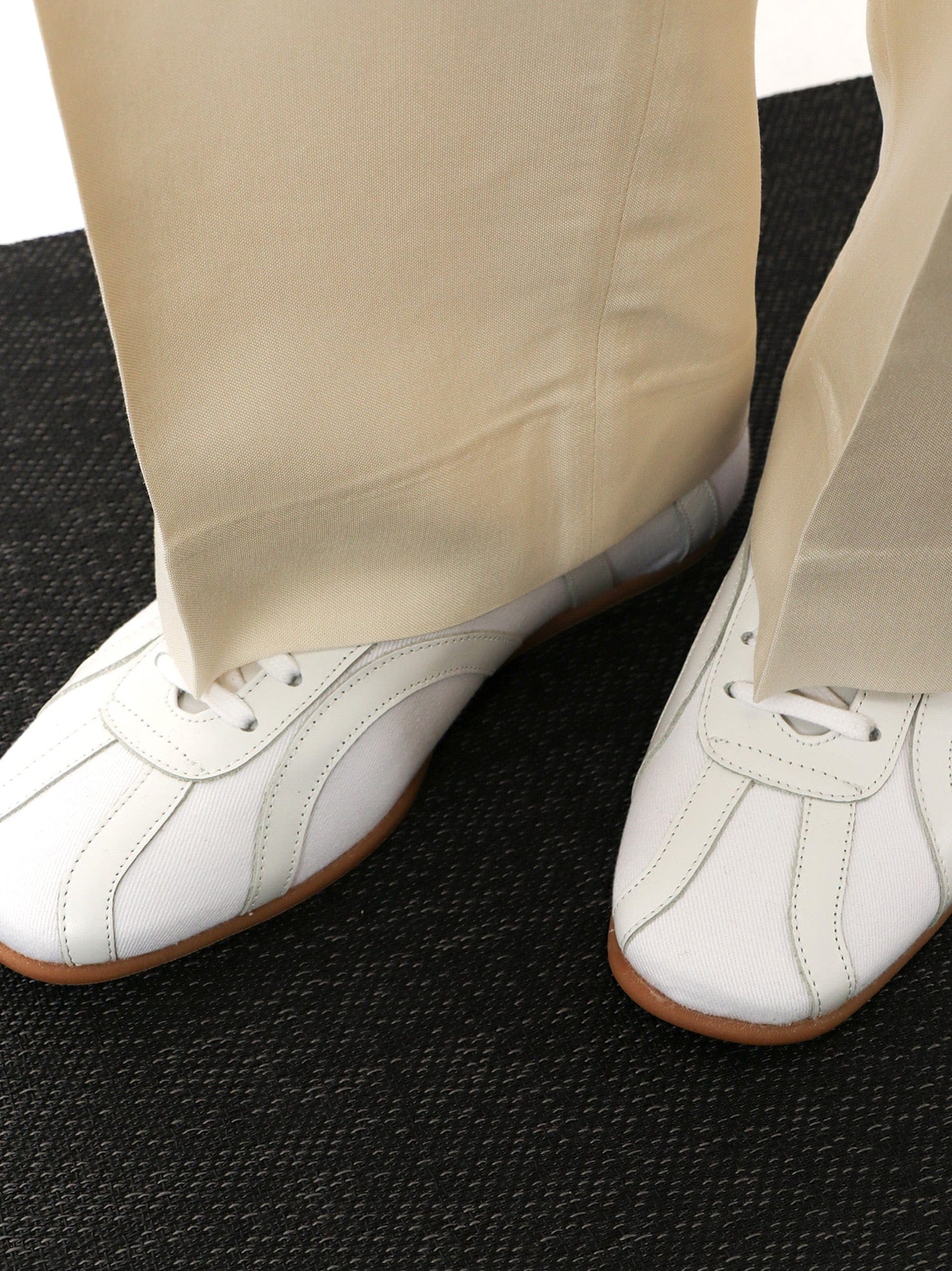 Toteme Canvas low - top sneakers with leather profiles