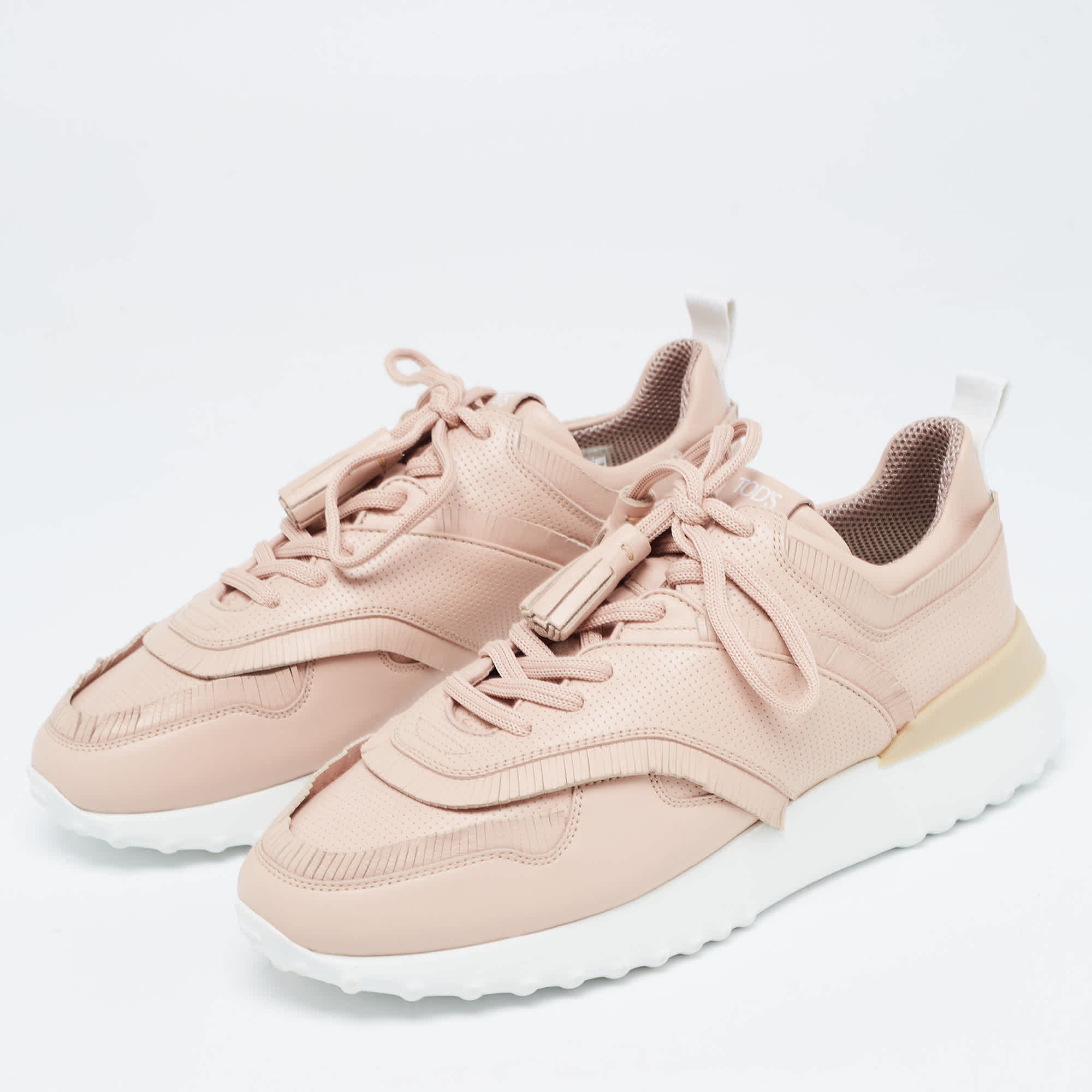 Tod's Pink Perforated Leather Fringed Low Top Sneakers