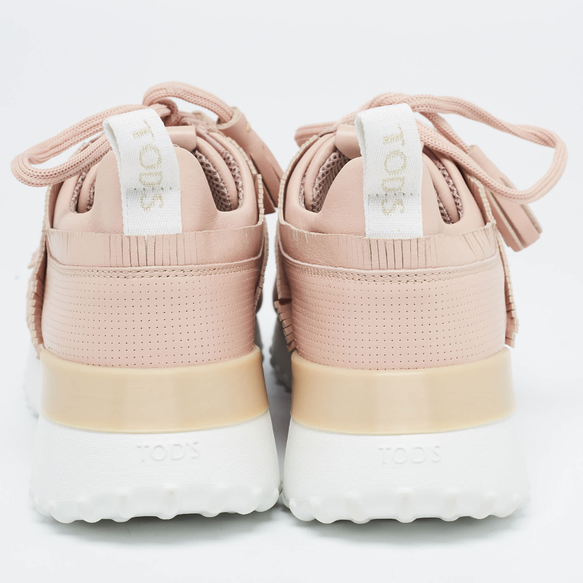 Tod's Pink Perforated Leather Fringed Low Top Sneakers