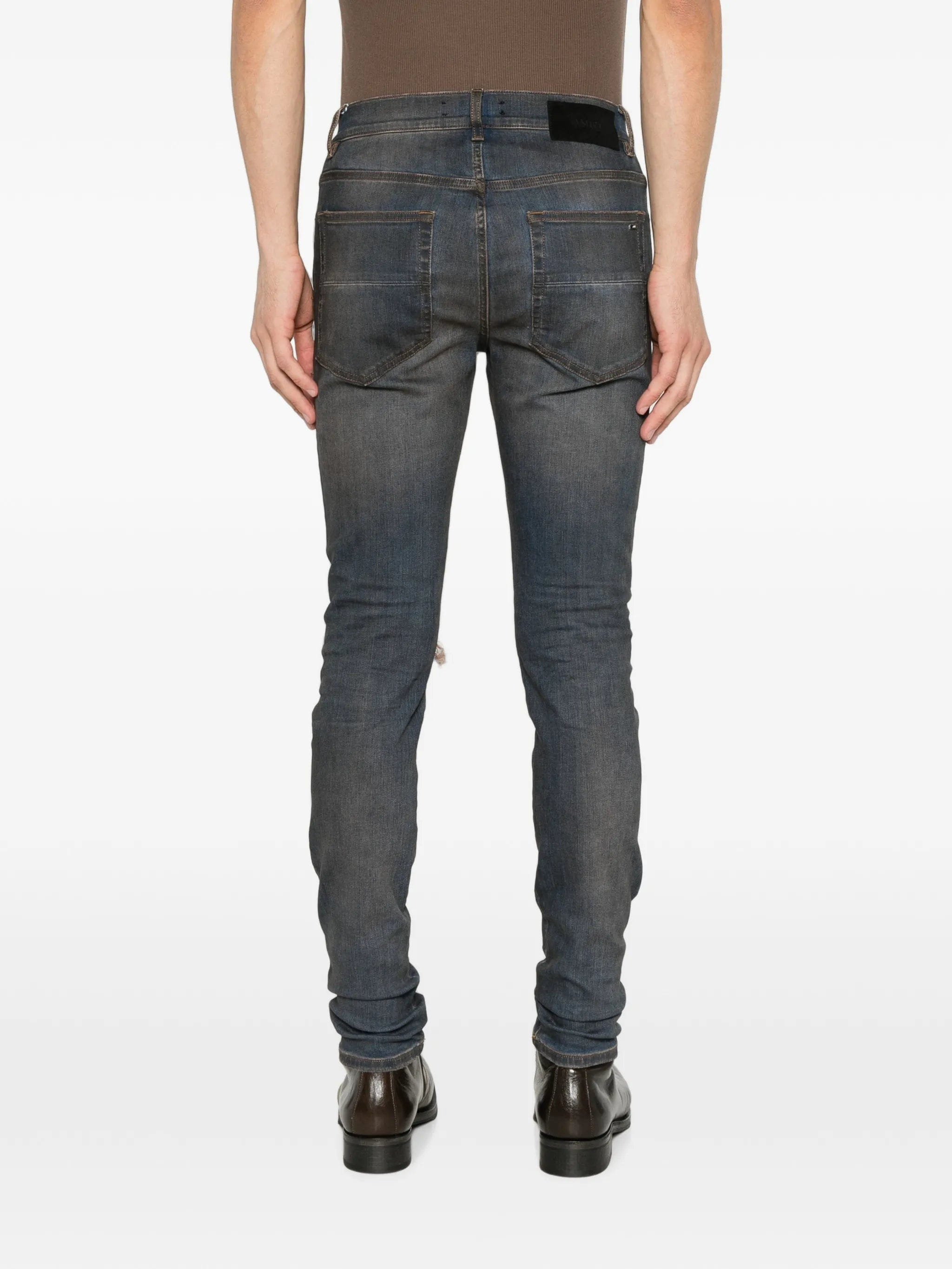 AMIRI Ultrasuede MX1 distressed slim - fit jeans