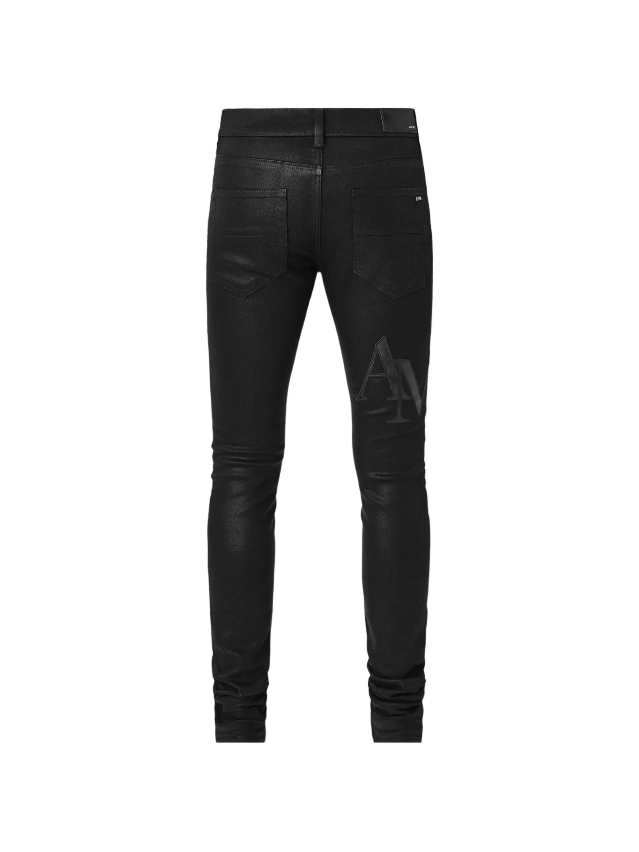 AMIRI waxed staggered logo jeans