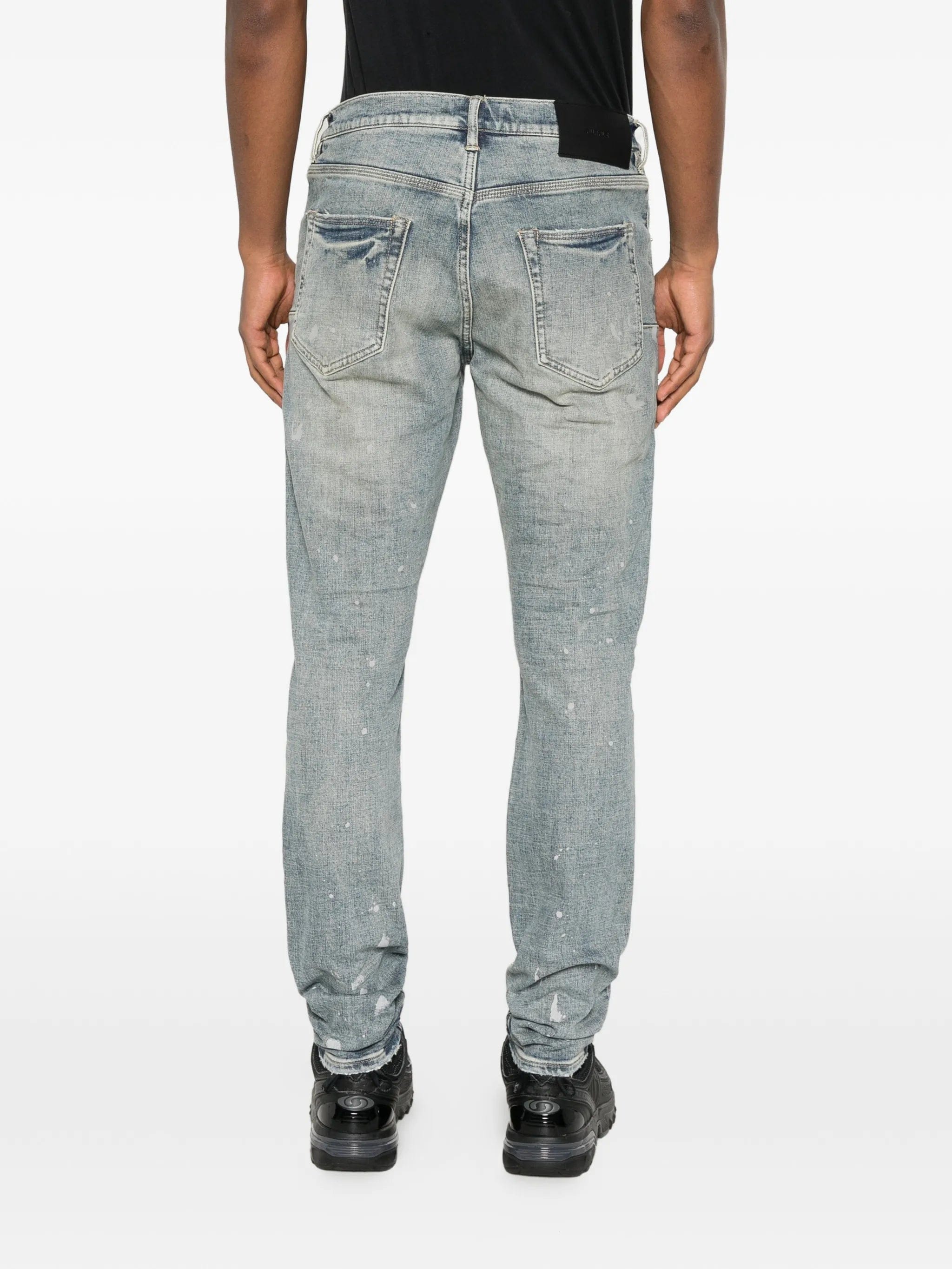 Purple Brand slashed paint jeans