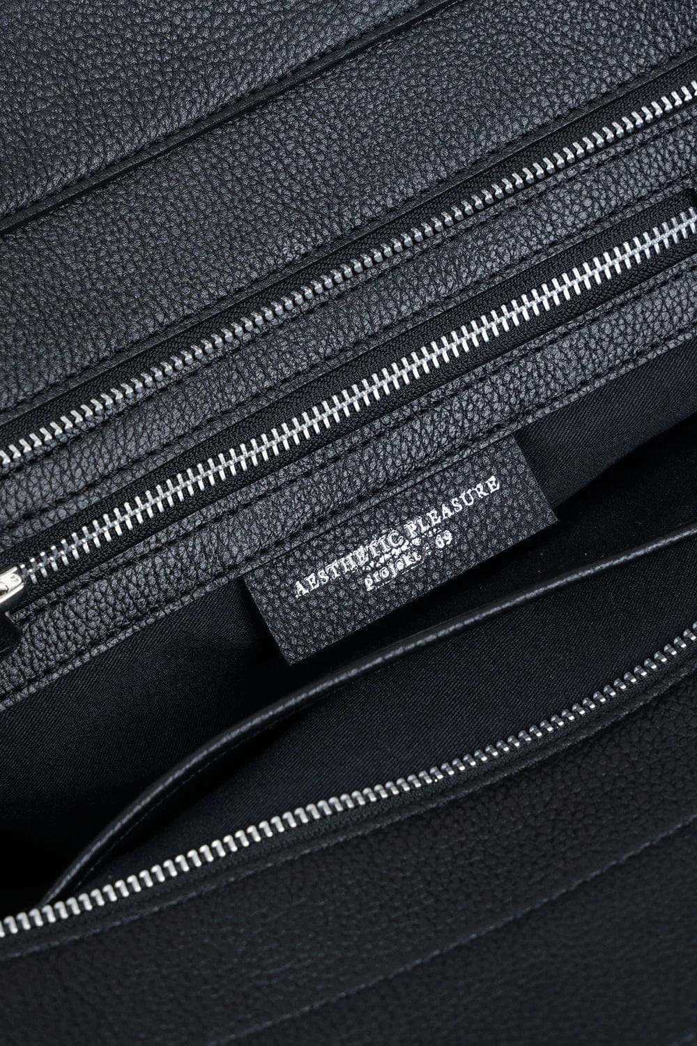 Aesthetic Pleasure Affix Grain Leather Shoulder Bag in Black