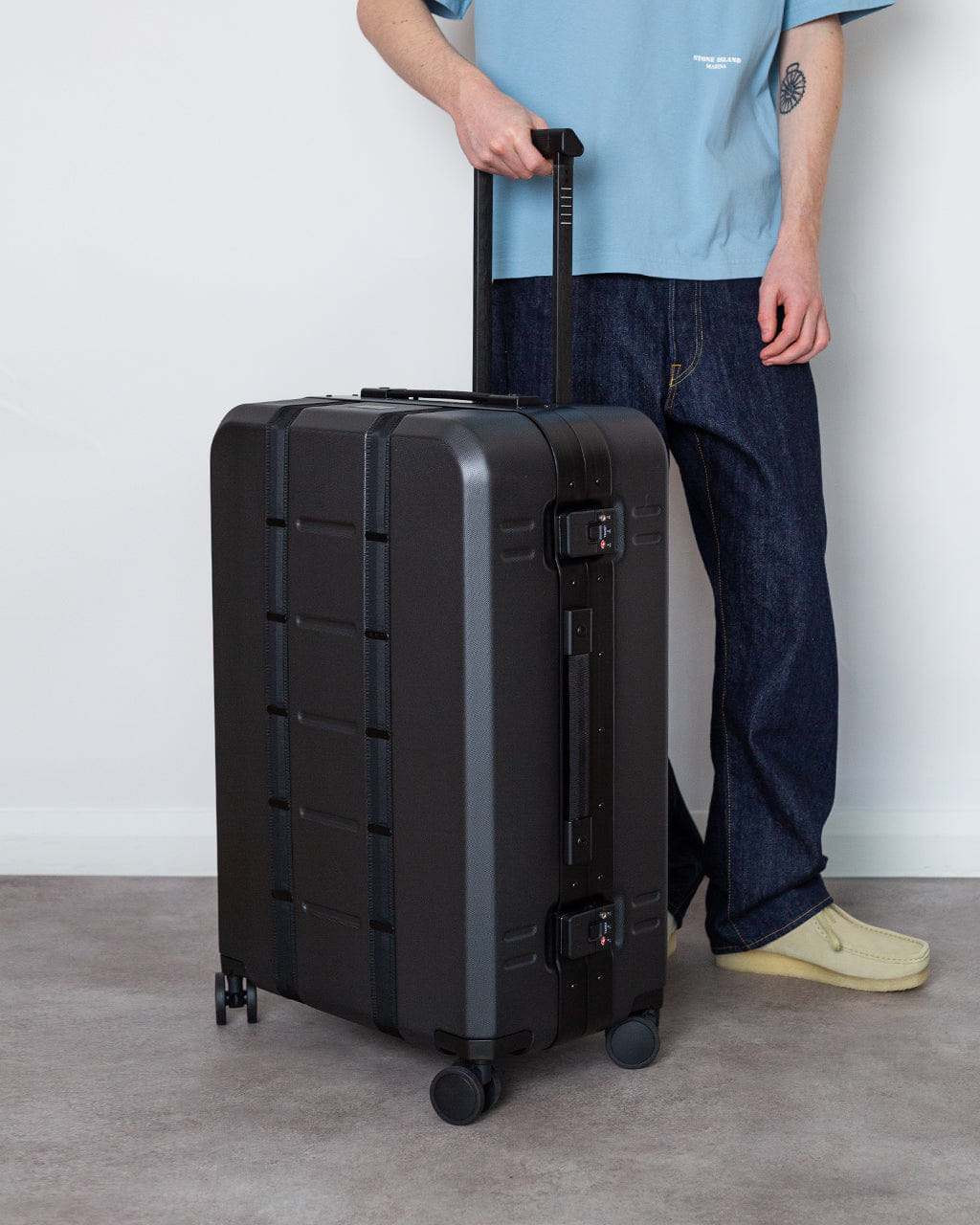 D_b_ Ramverk Pro Check - in Luggage - Black Out