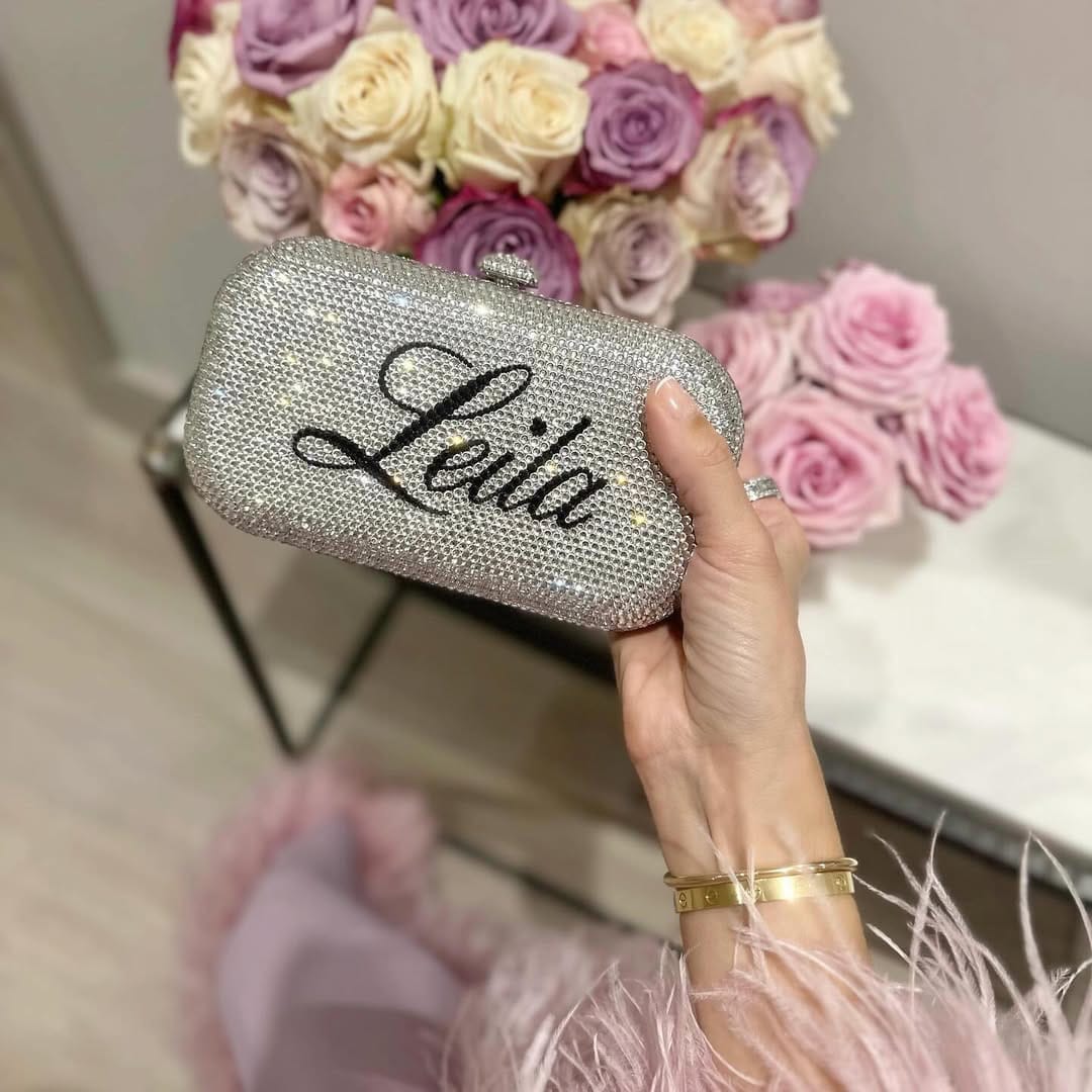 Ruya Customisable RÜYA Small Curve bag with a silver crystal finish and black personalised lettering. AKC0736