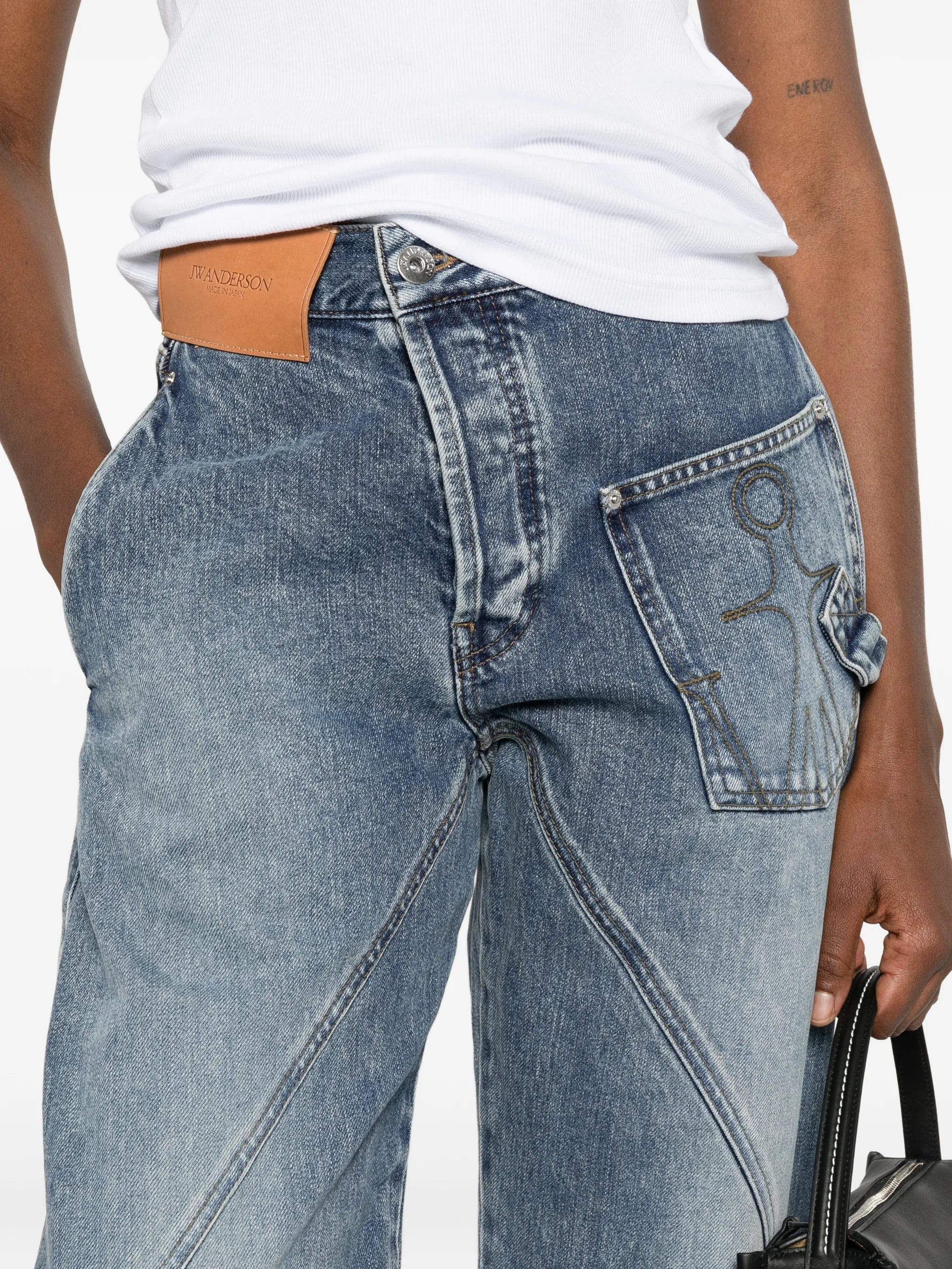 JW Anderson twisted - effect logo - patch denim jeans