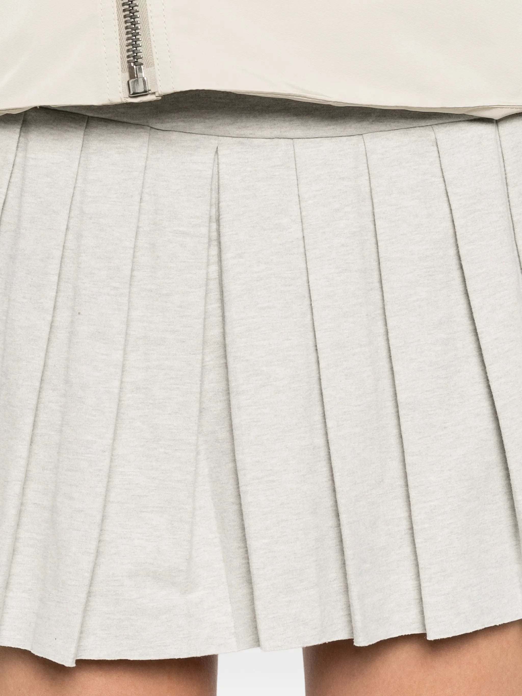 Norma Kamali pleated pickleball mini skirt