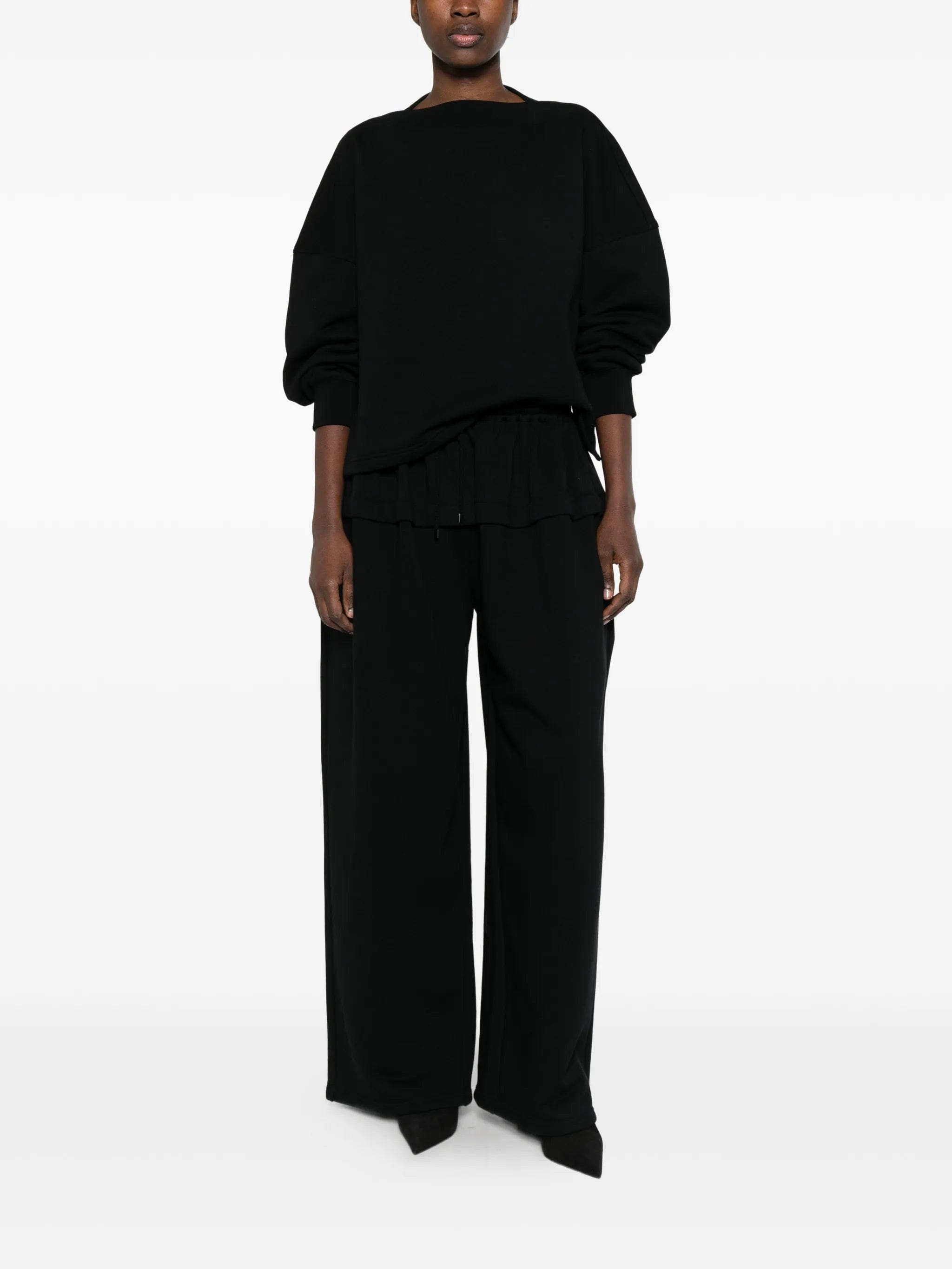 Alaïa peplum track pants