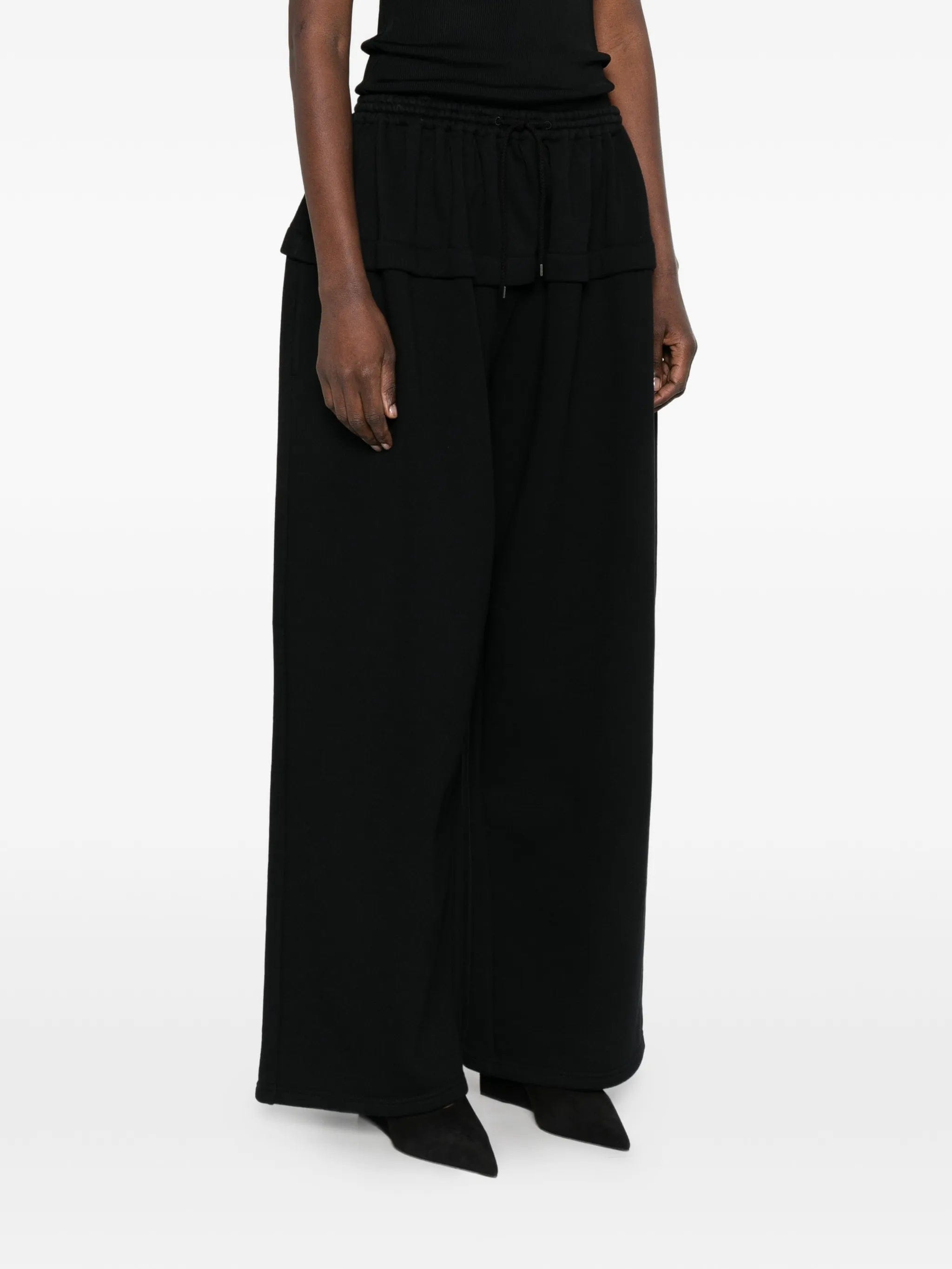 Alaïa peplum track pants
