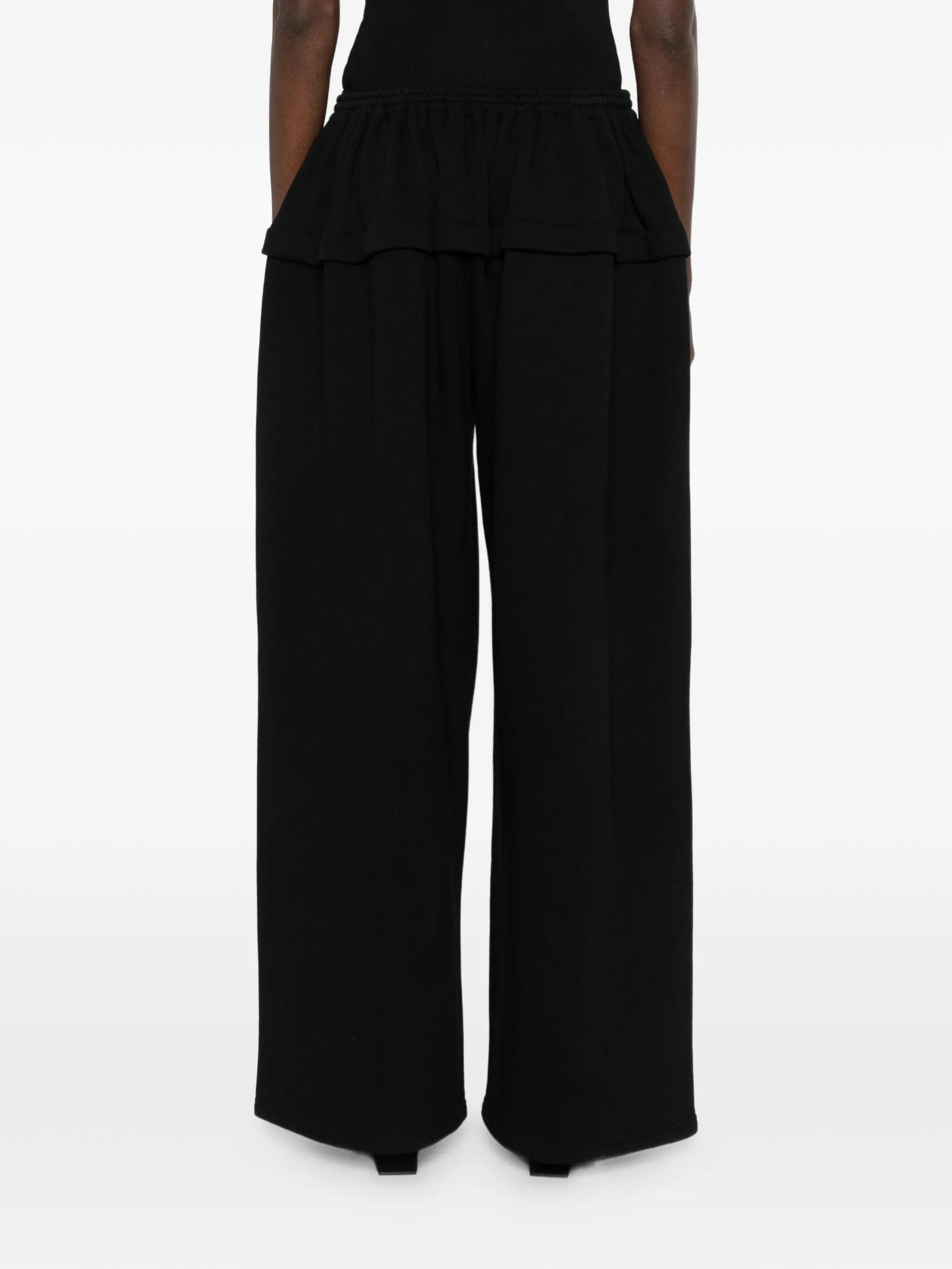 Alaïa peplum track pants