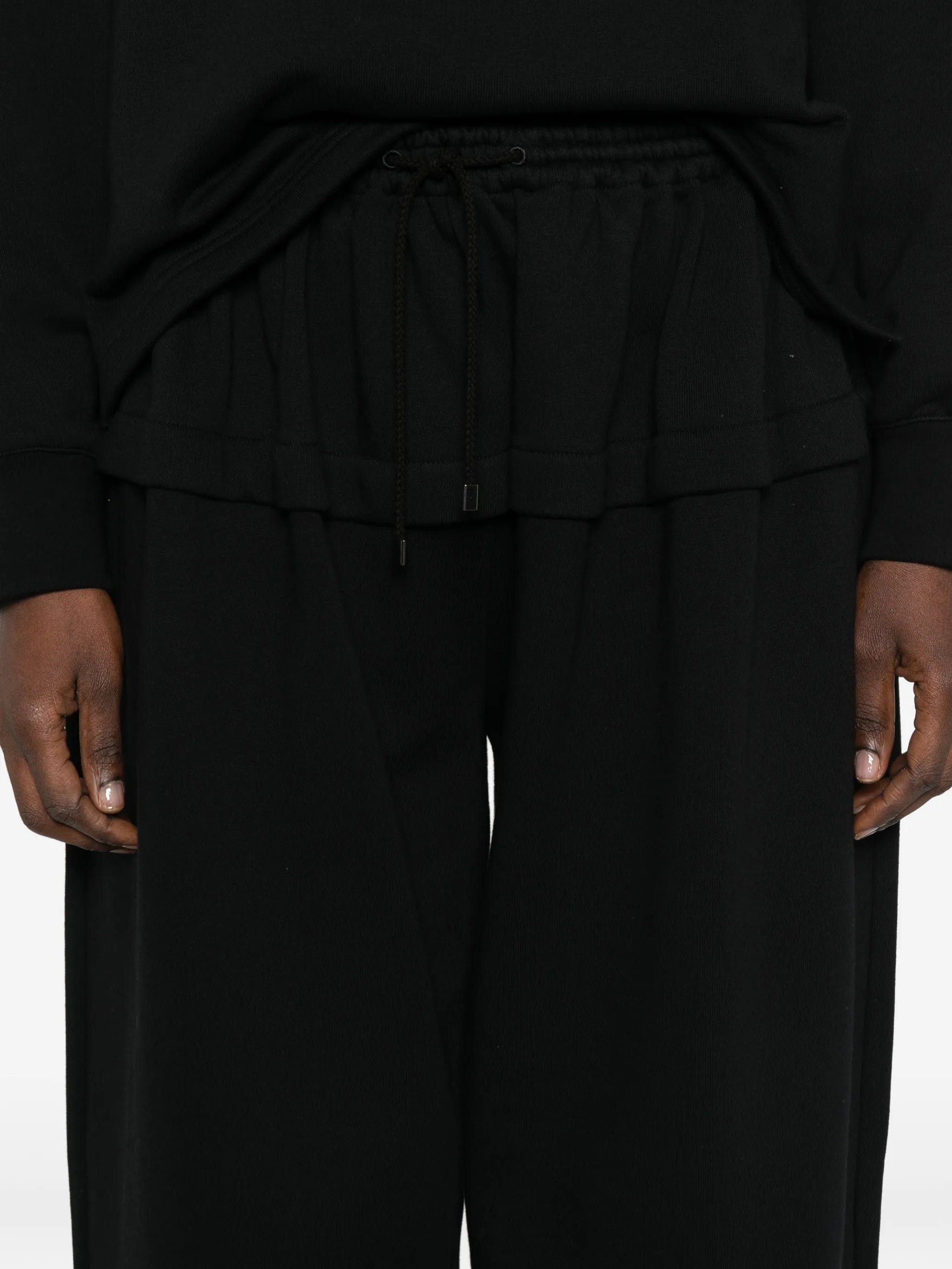 Alaïa peplum track pants