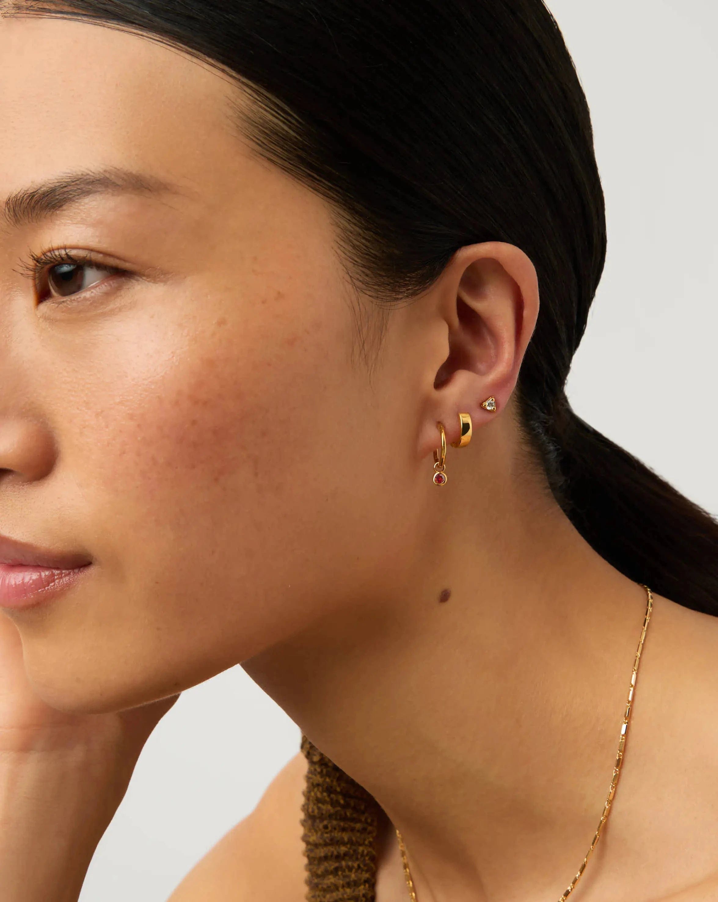 Missoma January Birthstone Mini Charm Hoop Earrings | 18ct Gold Vermeil/Garnet