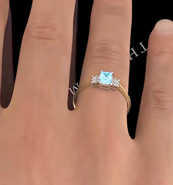 Diamond Blue Topaz 6 x 4 mm And Diamond Ring 9K Yellow Gold