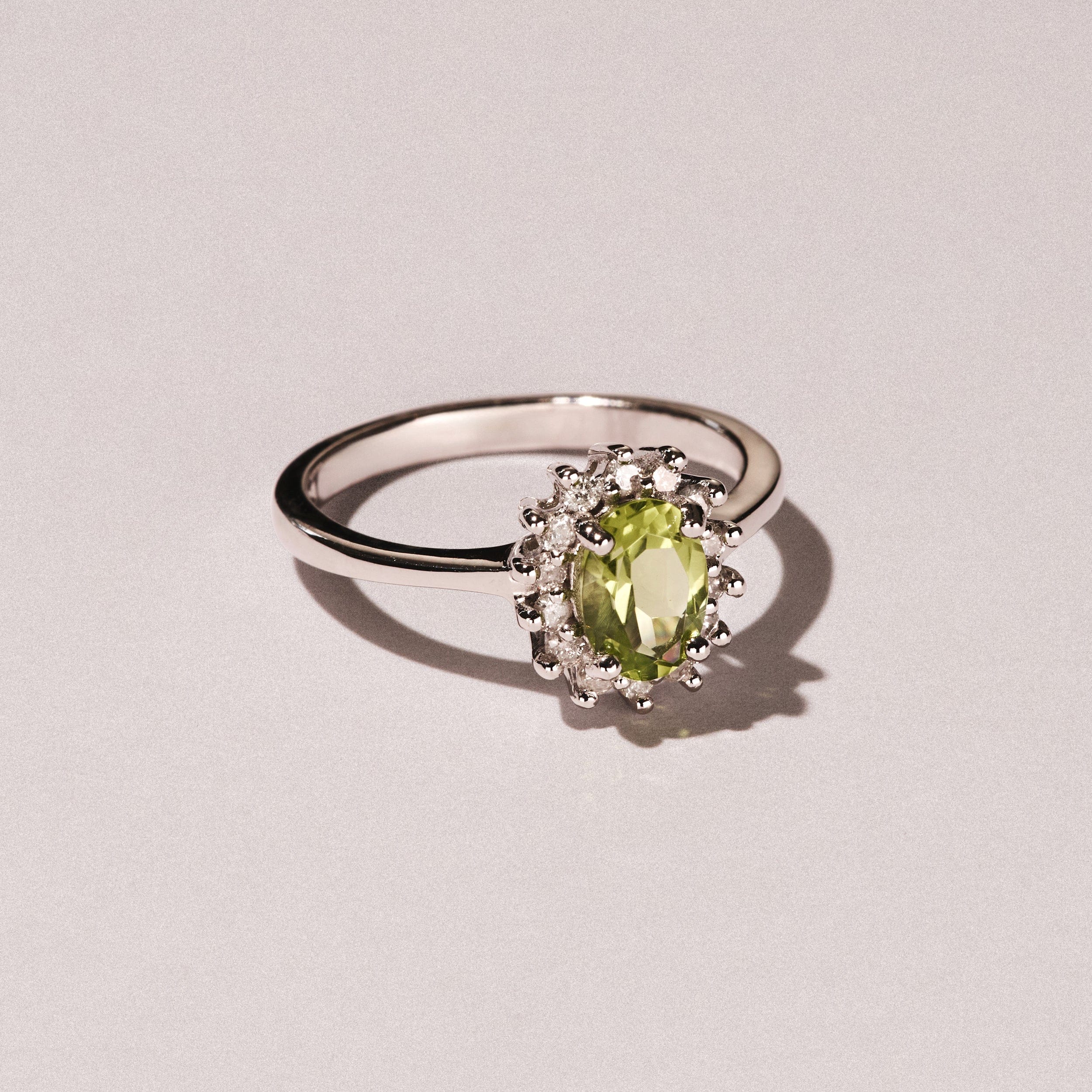 Diamond Peridot 7 x 5 mm And Diamond 9K White Gold Ring