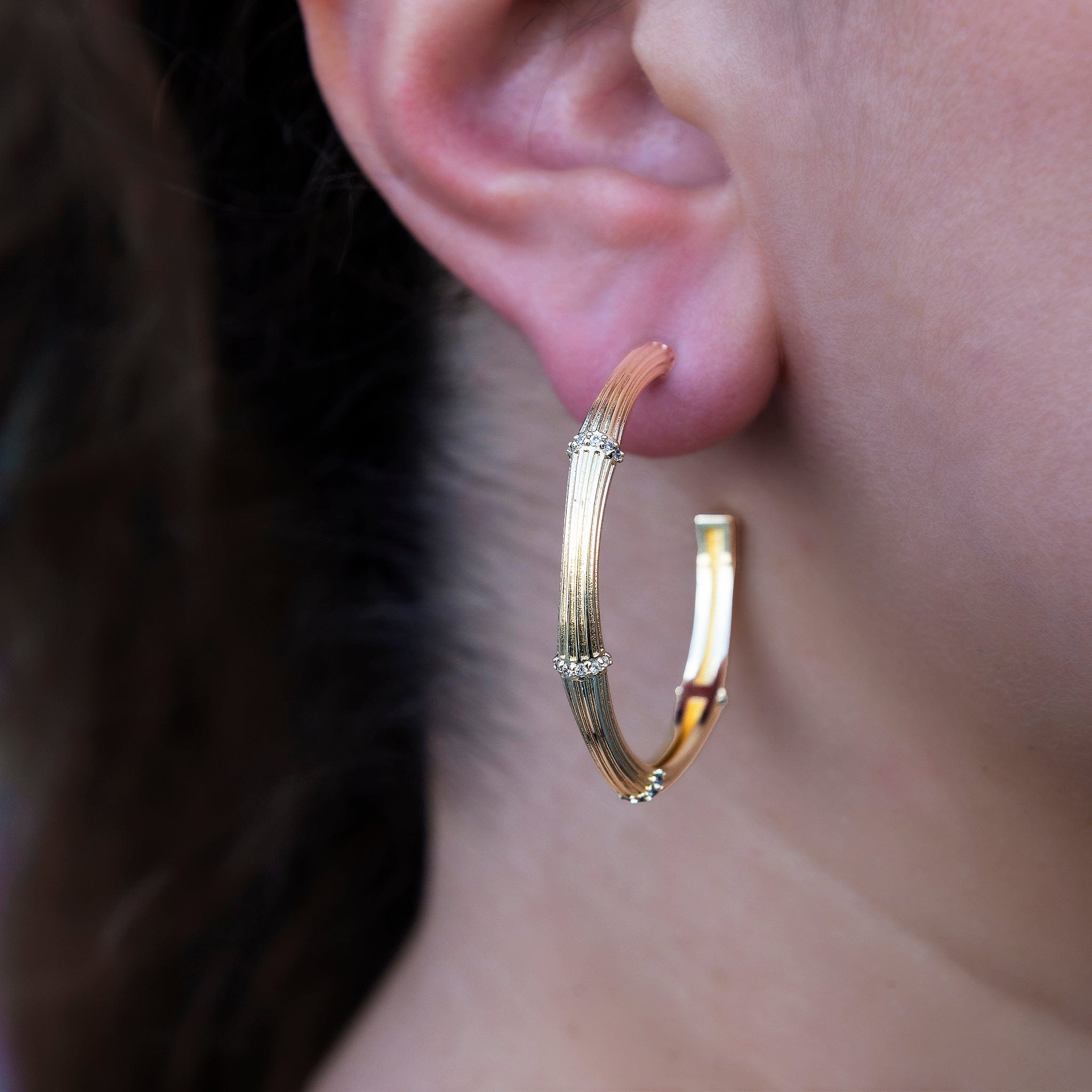 GLD Women Iced Textured Bamboo Hoop Earrings in Yellow Gold