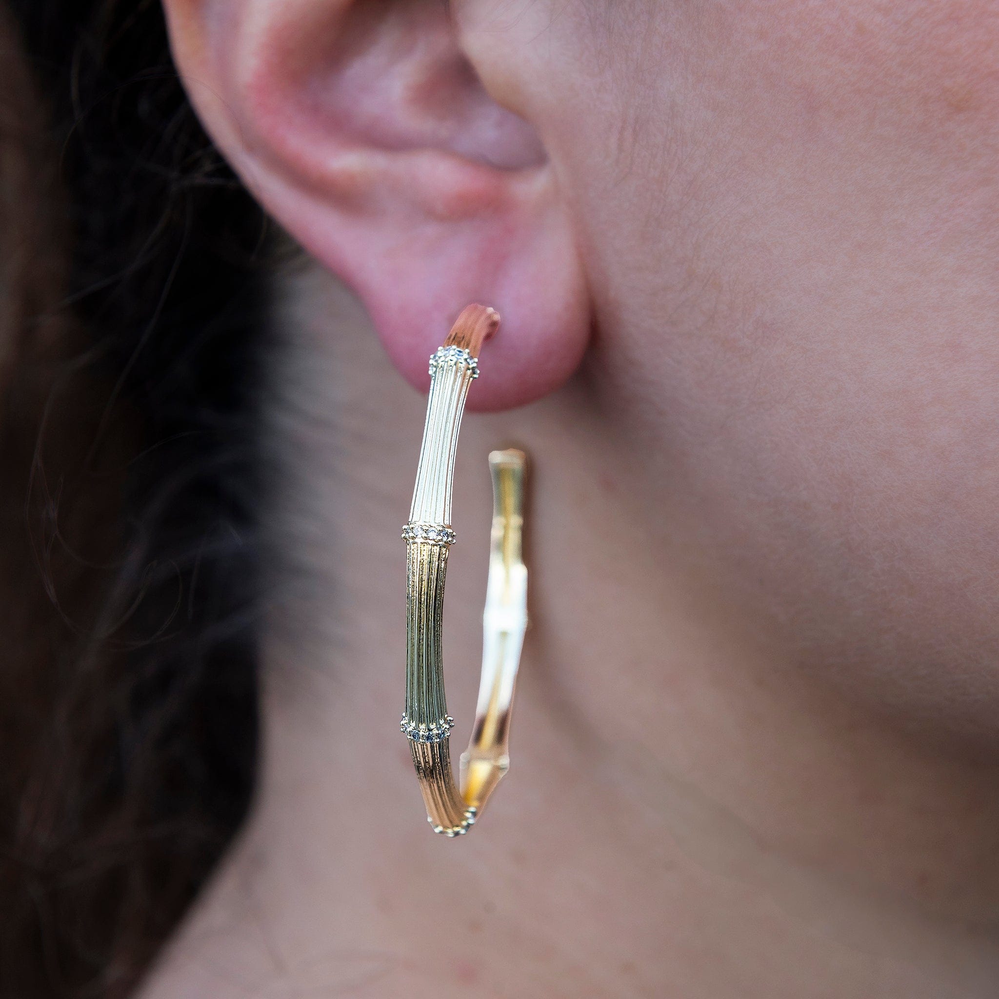GLD Women Iced Textured Bamboo Hoop Earrings in Yellow Gold