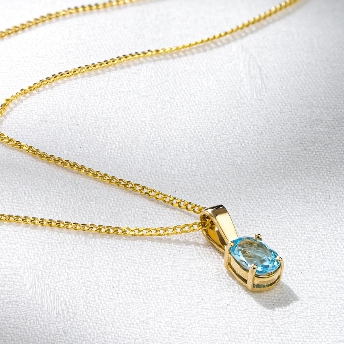 Yellow Blue Topaz 7 x 5 mm 9K Yellow Gold Pendant Necklace