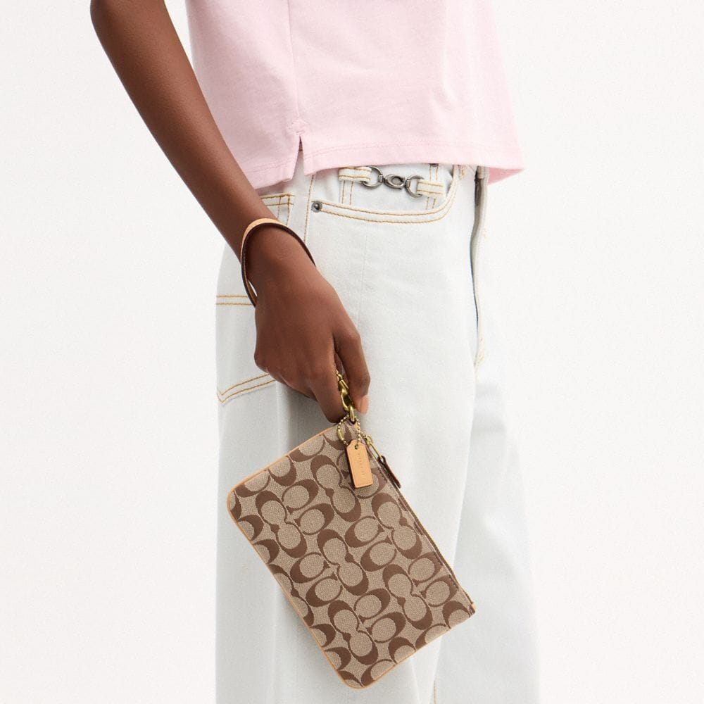 Coach Essential Small Wristlet In Signature Jacquard Brass Khaki Light Peach
