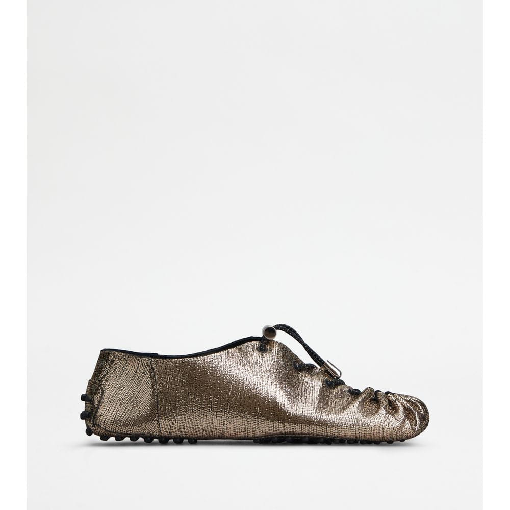 Tods Gommino In Leather With Drawstring Gold Womens