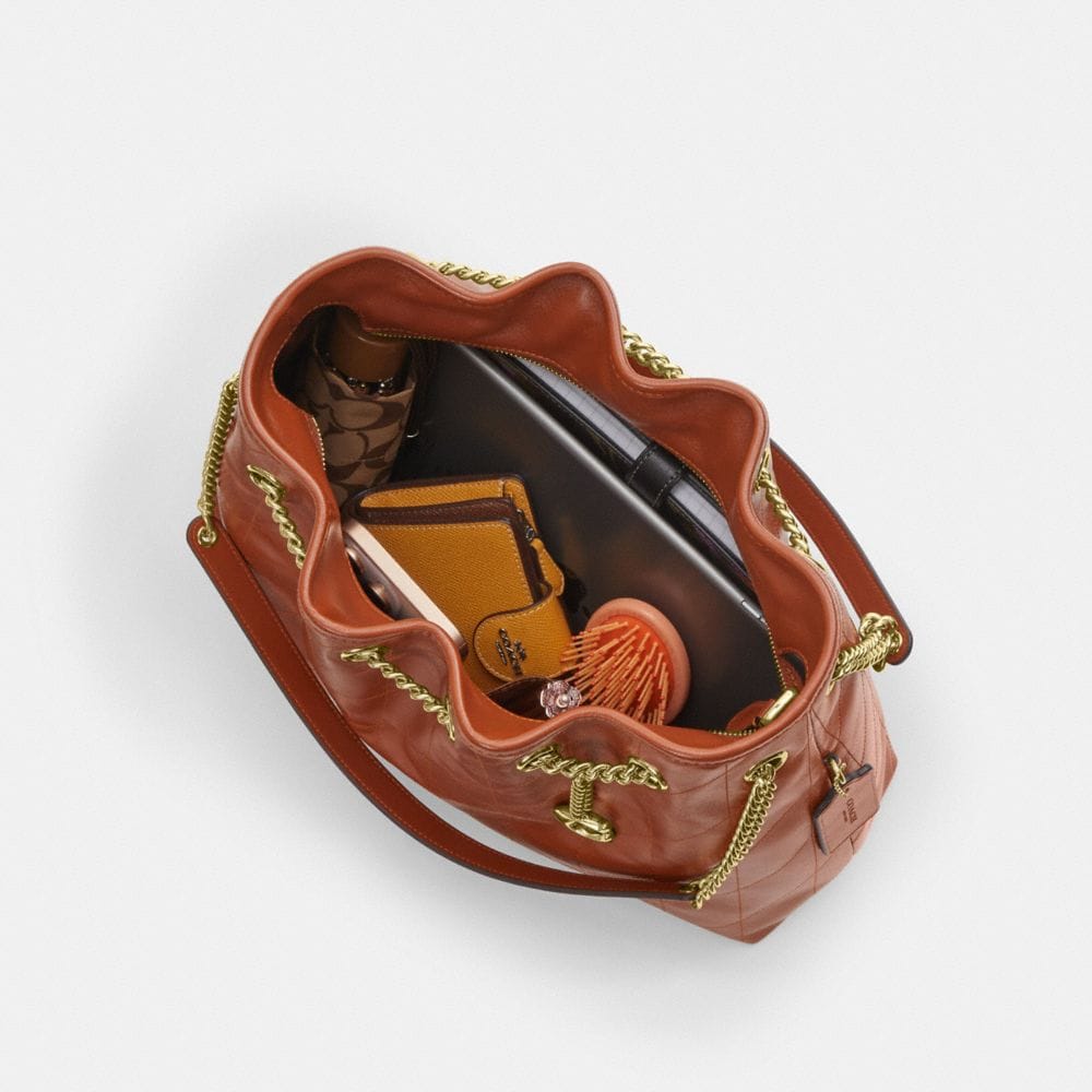 Coach Evelyn Shoulder Bag With Quilting And Charm Gold Cinnamon
