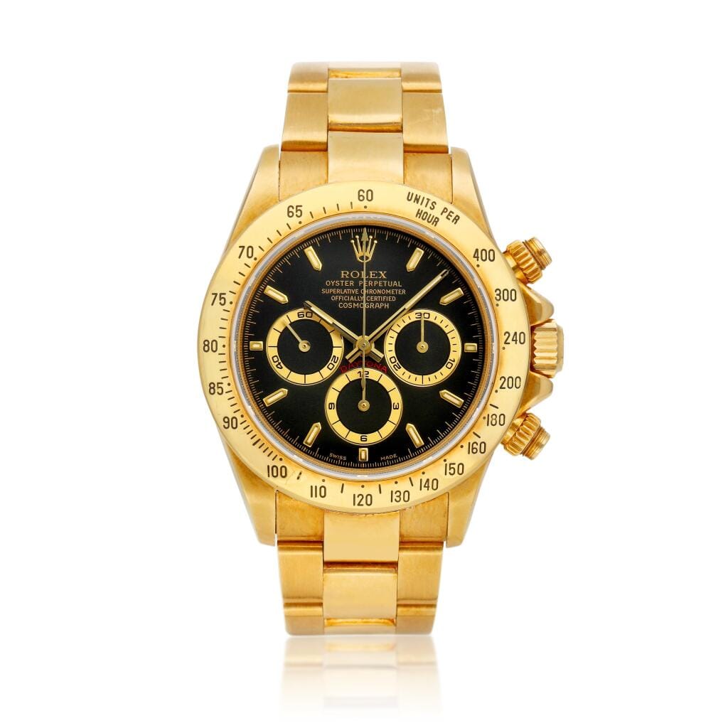 Cosmograph Daytona (Reference 16528). A yellow gold chronograph automatic wristwatch with bracelet. Circa 1999