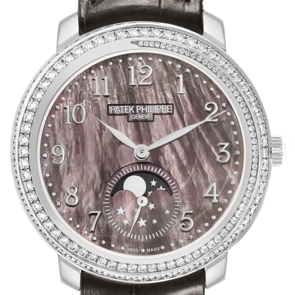 Complications (Reference 4968G). A 33.3mm white gold diamond-set manual wind wristwatch with moonphase.