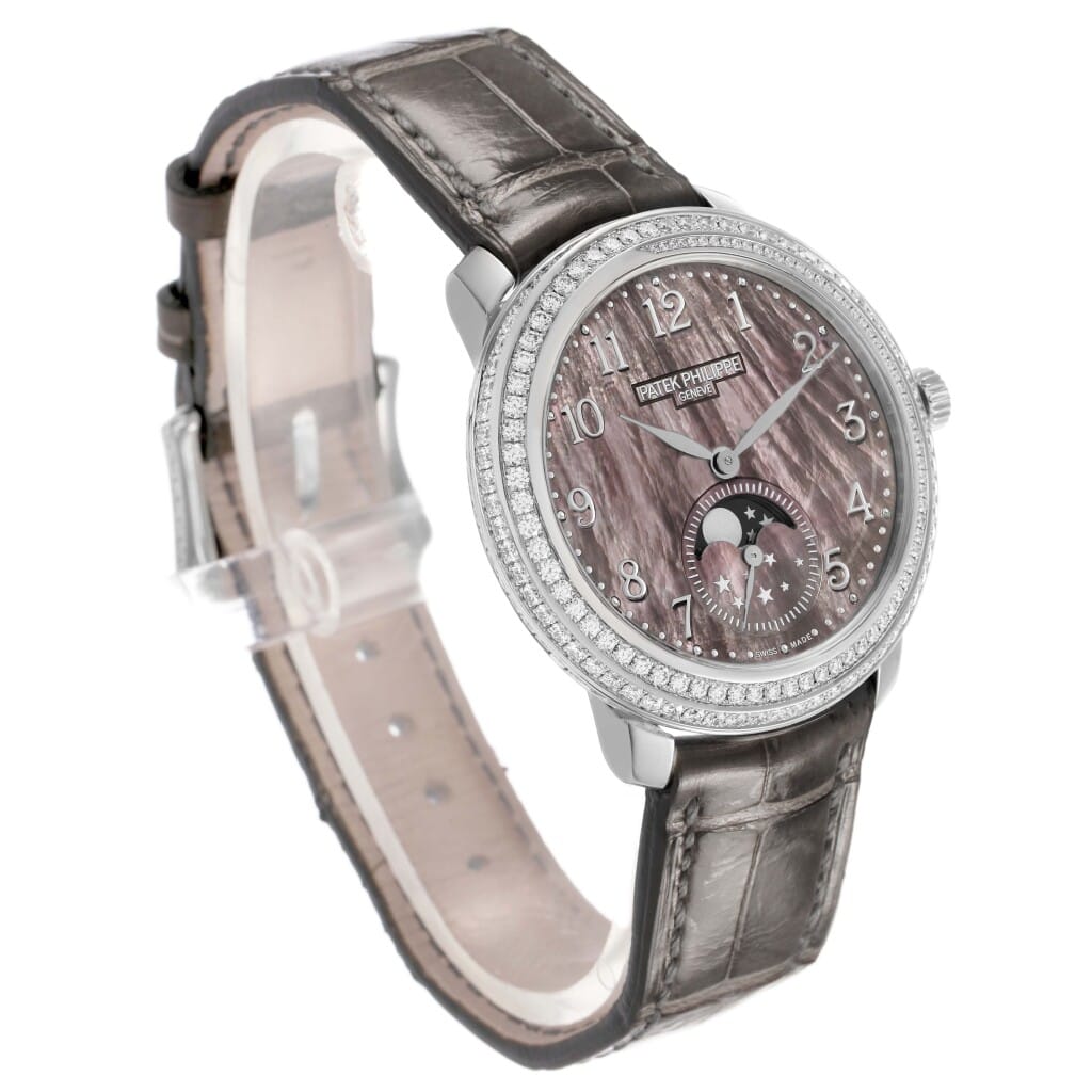 Complications (Reference 4968G). A 33.3mm white gold diamond-set manual wind wristwatch with moonphase.