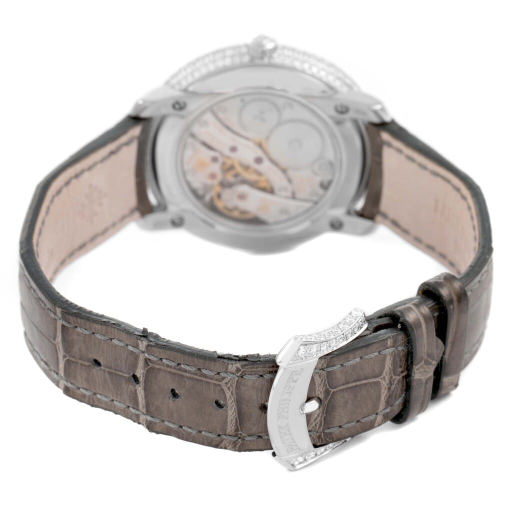 Complications (Reference 4968G). A 33.3mm white gold diamond-set manual wind wristwatch with moonphase.