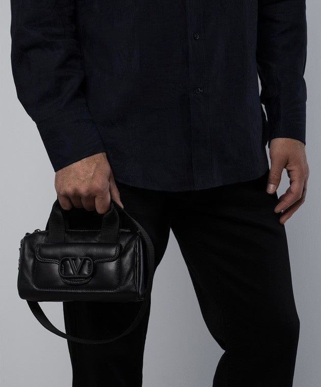 Black leather bag with logo