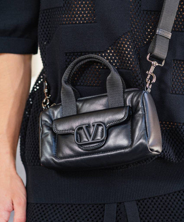 Black leather bag with logo