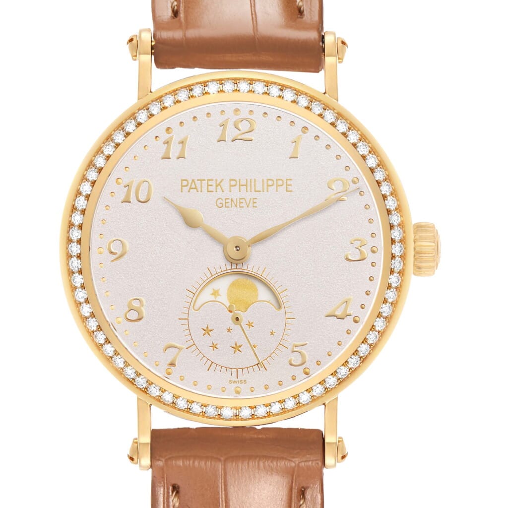 Calatrava (Reference 7121J). A 33mm yellow gold diamond-set manual wind wristwatch with moon phase.