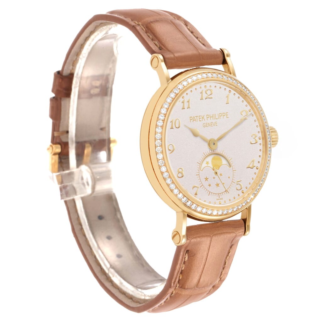 Calatrava (Reference 7121J). A 33mm yellow gold diamond-set manual wind wristwatch with moon phase.