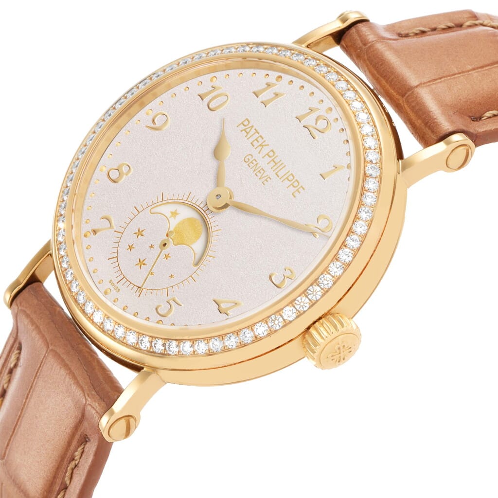 Calatrava (Reference 7121J). A 33mm yellow gold diamond-set manual wind wristwatch with moon phase.